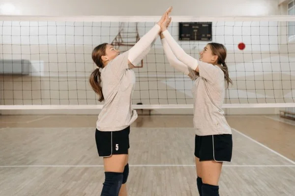 volleyball team celebrating victory